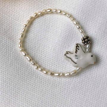 Dove bracelet in pearls and porcelain
