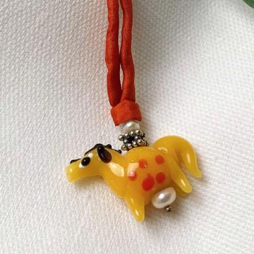 Horse pendant in spun glass