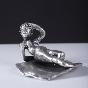 Silver plated bathers, silver, on her back [1]
