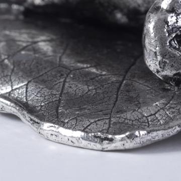 Silver plated bathers, silver, on her belly [3]