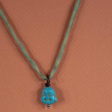 Charm in spun glass and turquoise