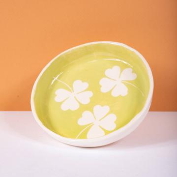 Cover dish in stamped earthenware