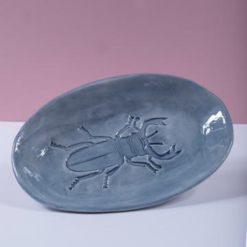 Scarabée dish in stamped earthenware, gray